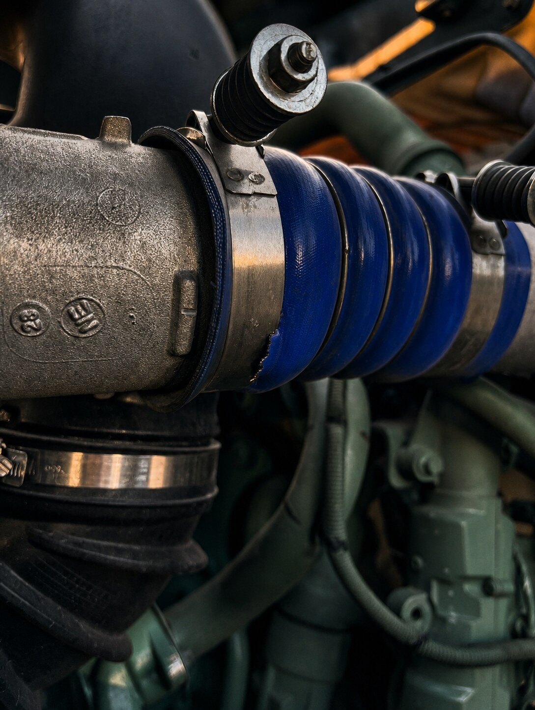 Air Intake Hose Damage: Cut found in the semi-truck air-intake hose