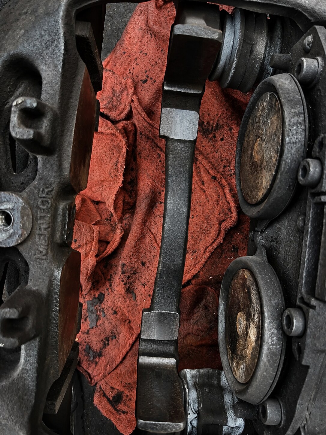 Brake Caliper Cleaning: Cleaned brake caliper — after service